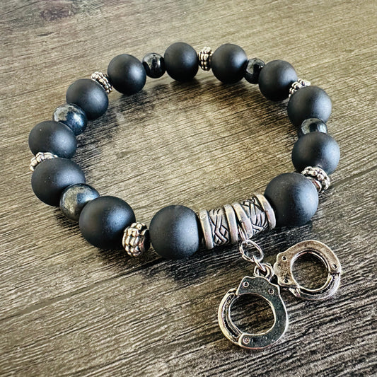 Bold Bond: Black and Metal Bracelet with Handcuffs Charm - Roxiem Jewelry, LLC